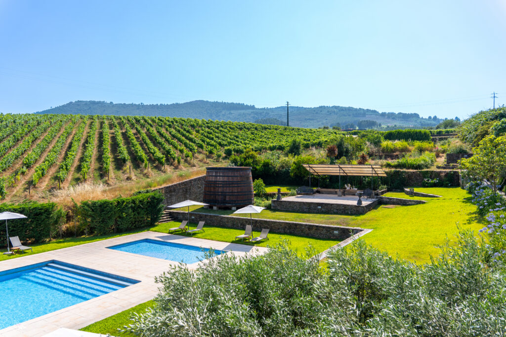 Pool, vineyard and gardens at The Manor House Celeirós, luxury wedding venue in Portugal