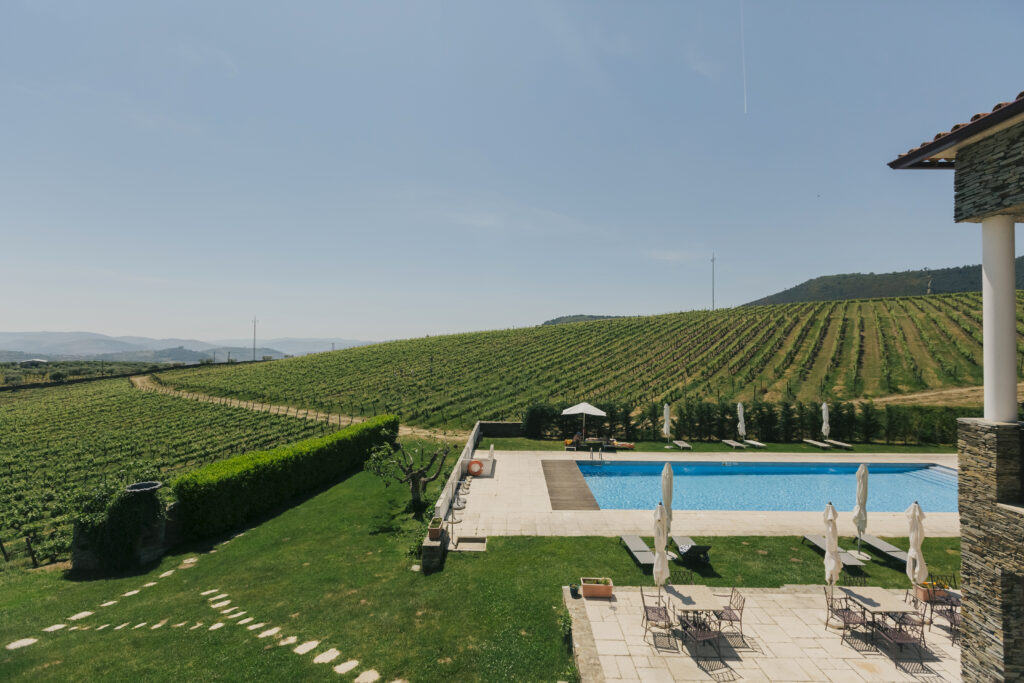 Vineyard and pool at The Manor House Celeirós, luxury wedding venue in Portugal