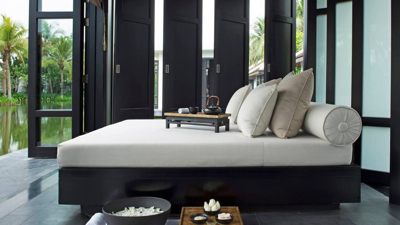 Lovely modern bedroom with view of nature and lake