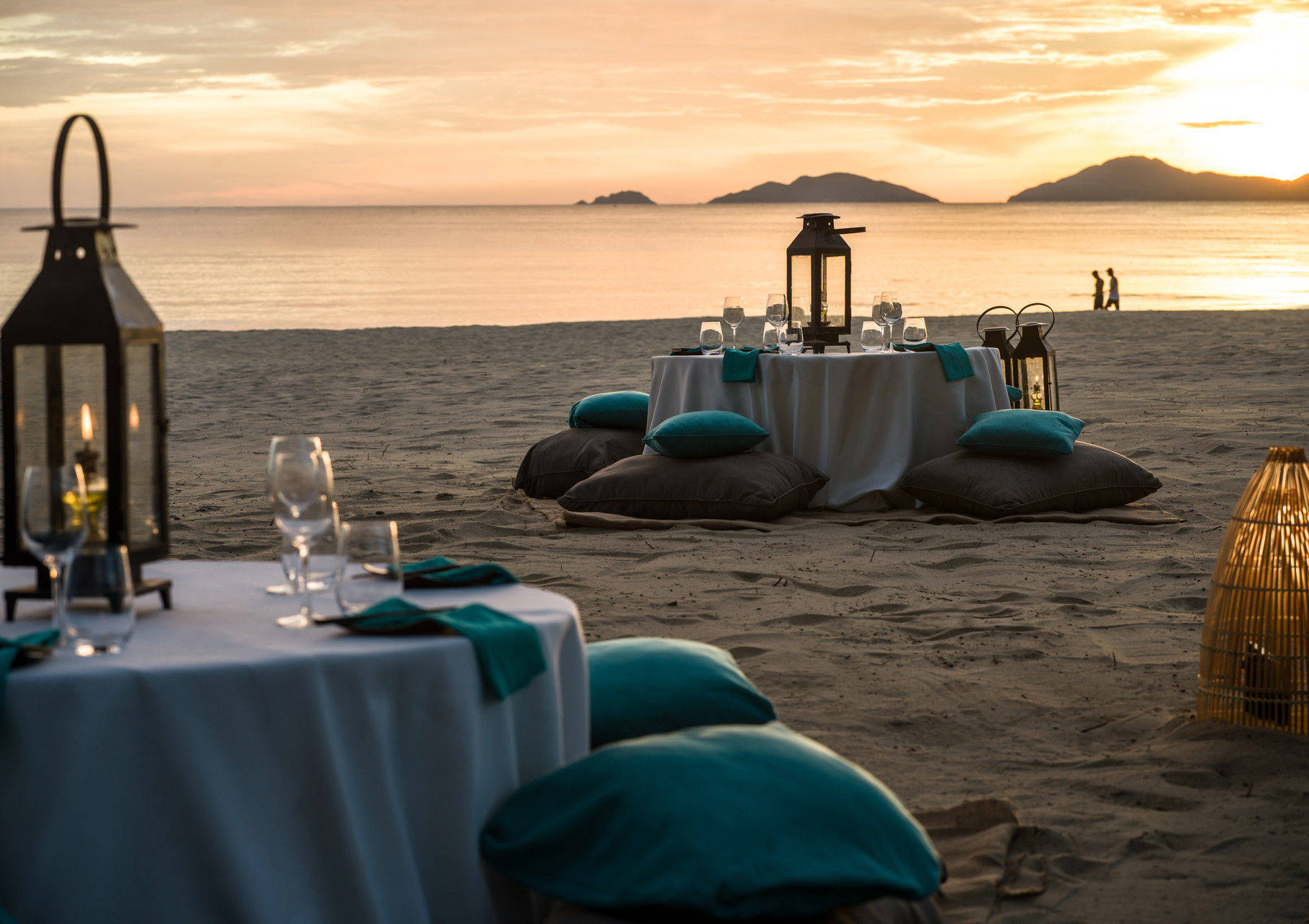 Cosy beach floor table with view of sunset
