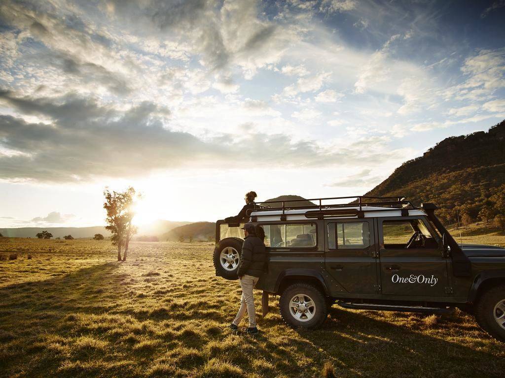 Safari vehicle with stunning sunset view