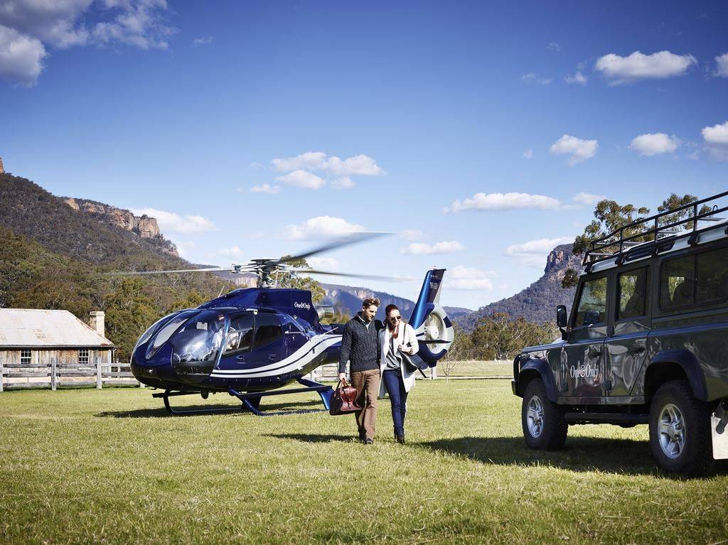 Couple leaving helicopter