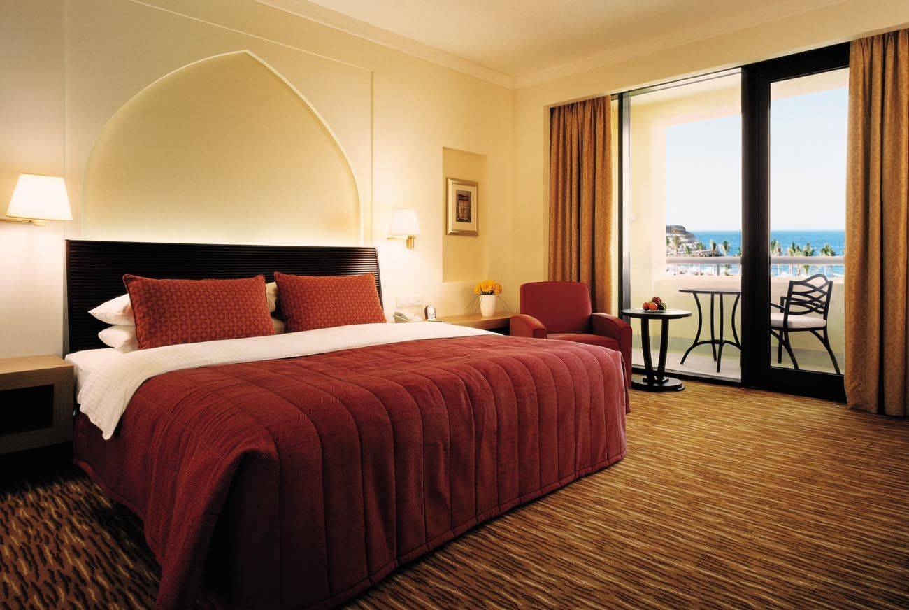 Bedroom with balcony overlooking the sea
