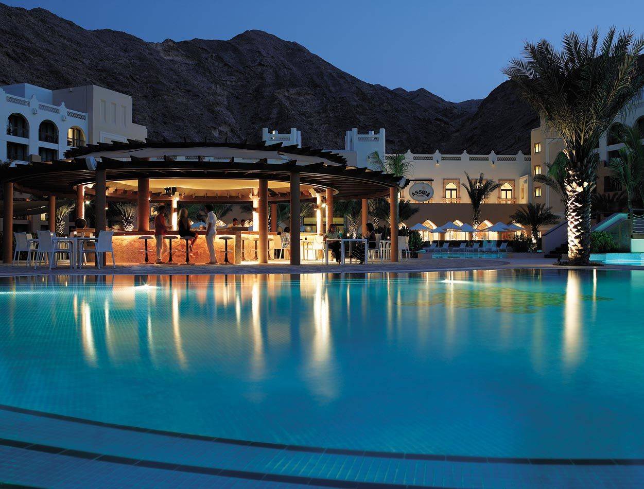 Swimming pool with circular bar right next to it