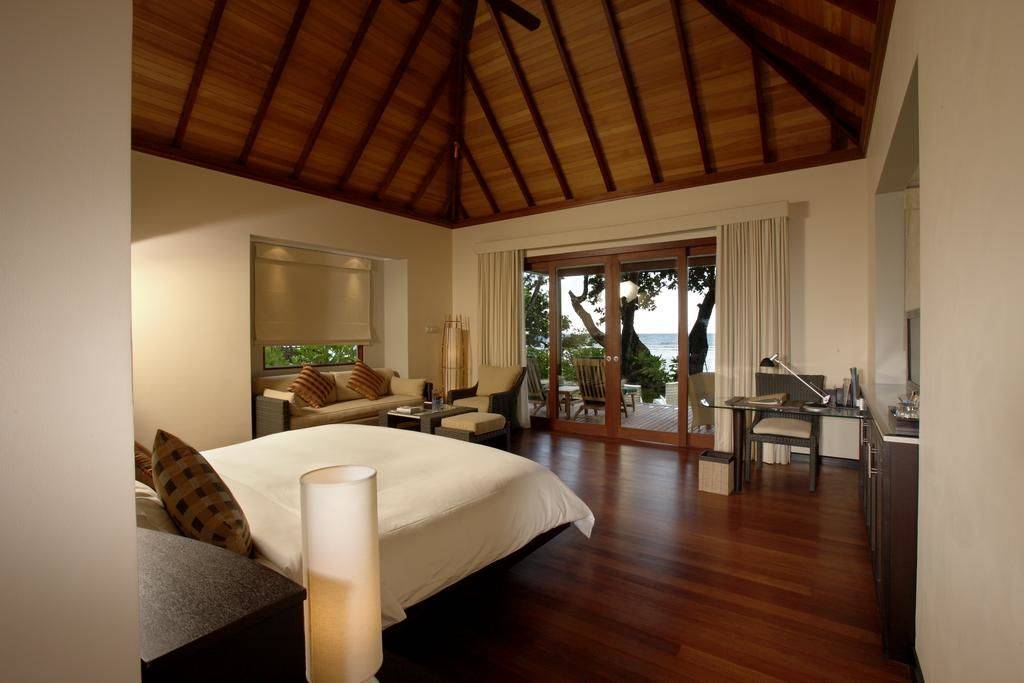 Bedroom with bamboo ceiling at the Hilton Seychelles Labriz Resort & Spa