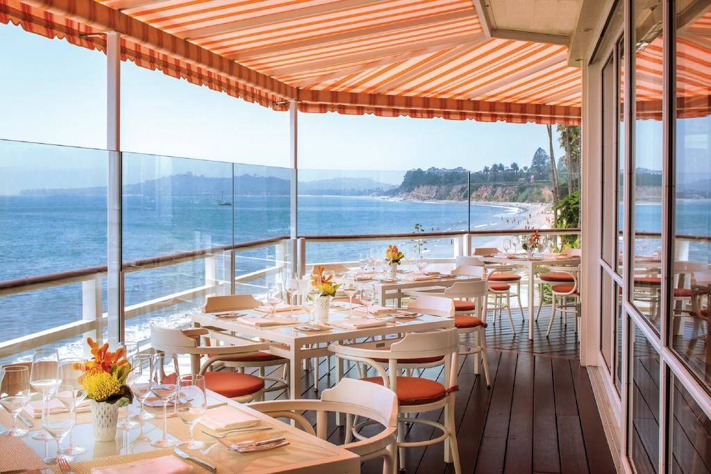 breakfast tables on the deck overlooking the ocean at Four Seasons Resort The Biltmore Santa Barbara