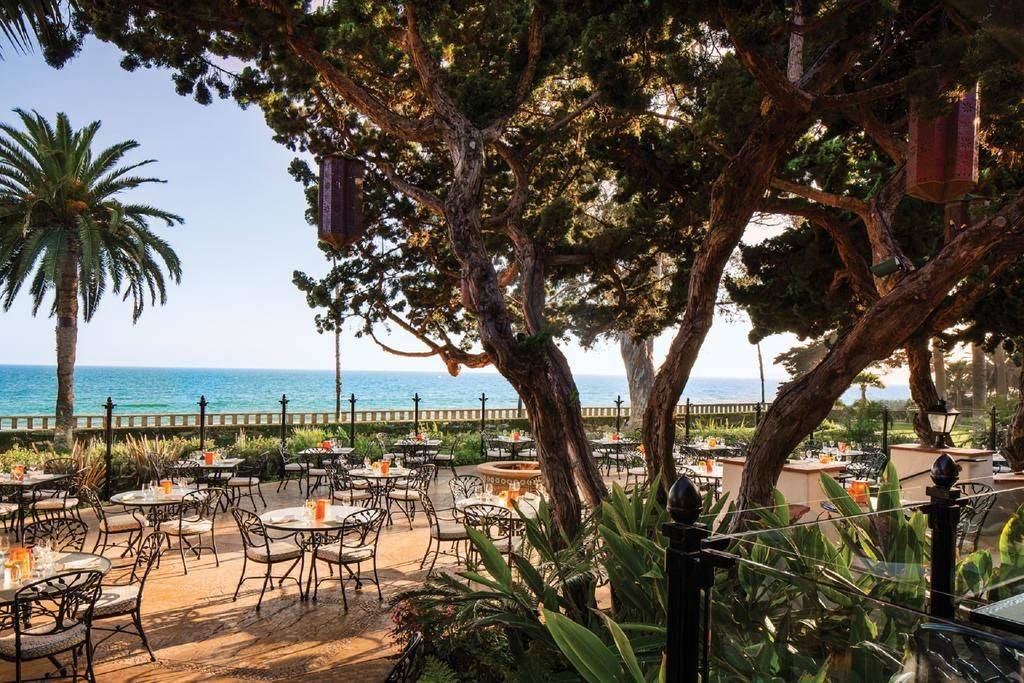 outdoor furniture on the deck overlooking the sea at the Four Seasons Resort The Biltmore Santa Barbara