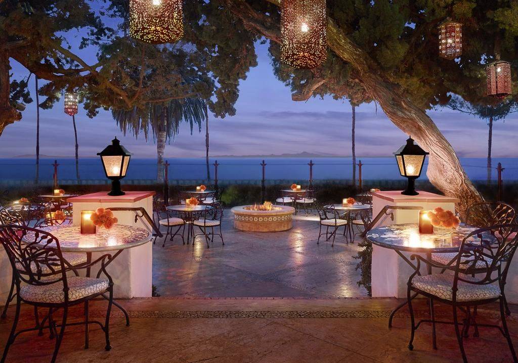 candle light dinner tables set up overlooking the ocean at the Four Seasons Resort The Biltmore Santa Barbara