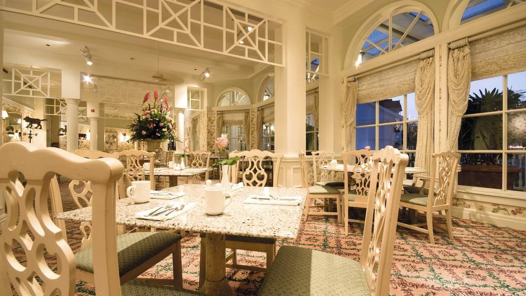 well lit up and decorated dining set up in a restaurant at the Disneys Grand Floridian Resort & Spa