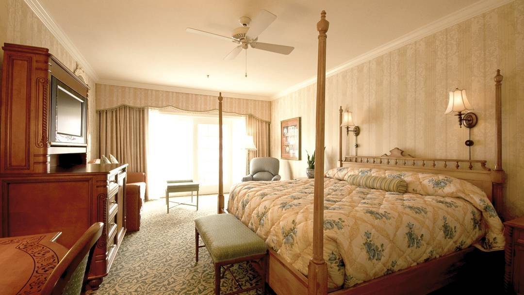 cozy bedroom with a double bed at Disneys Grand Floridian Resort & Spa