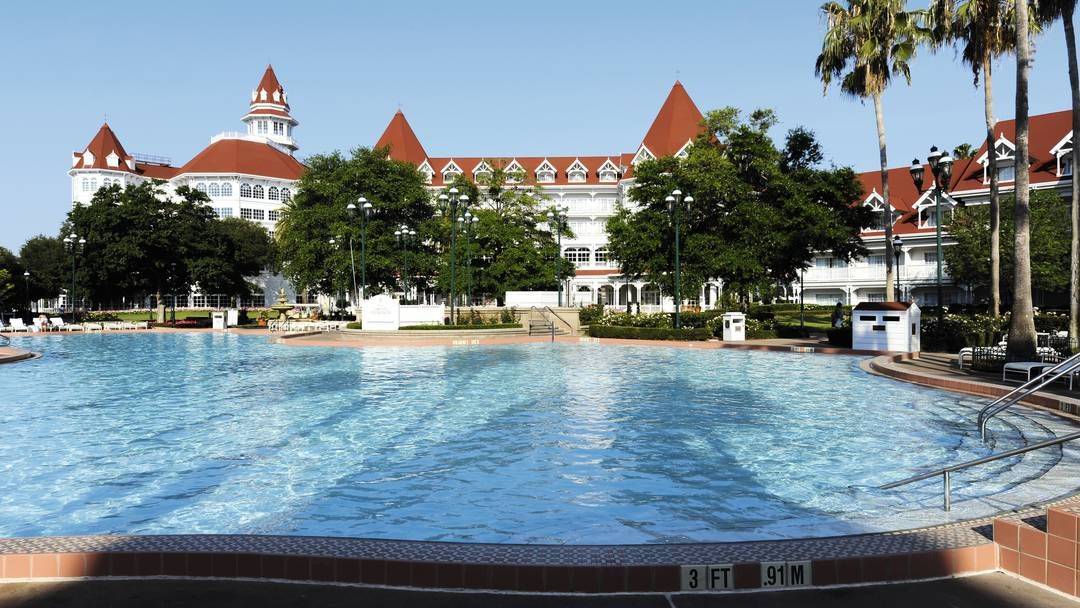 large swimming pool in the outdoor area of the Disneys Grand Floridian Resort & Spa