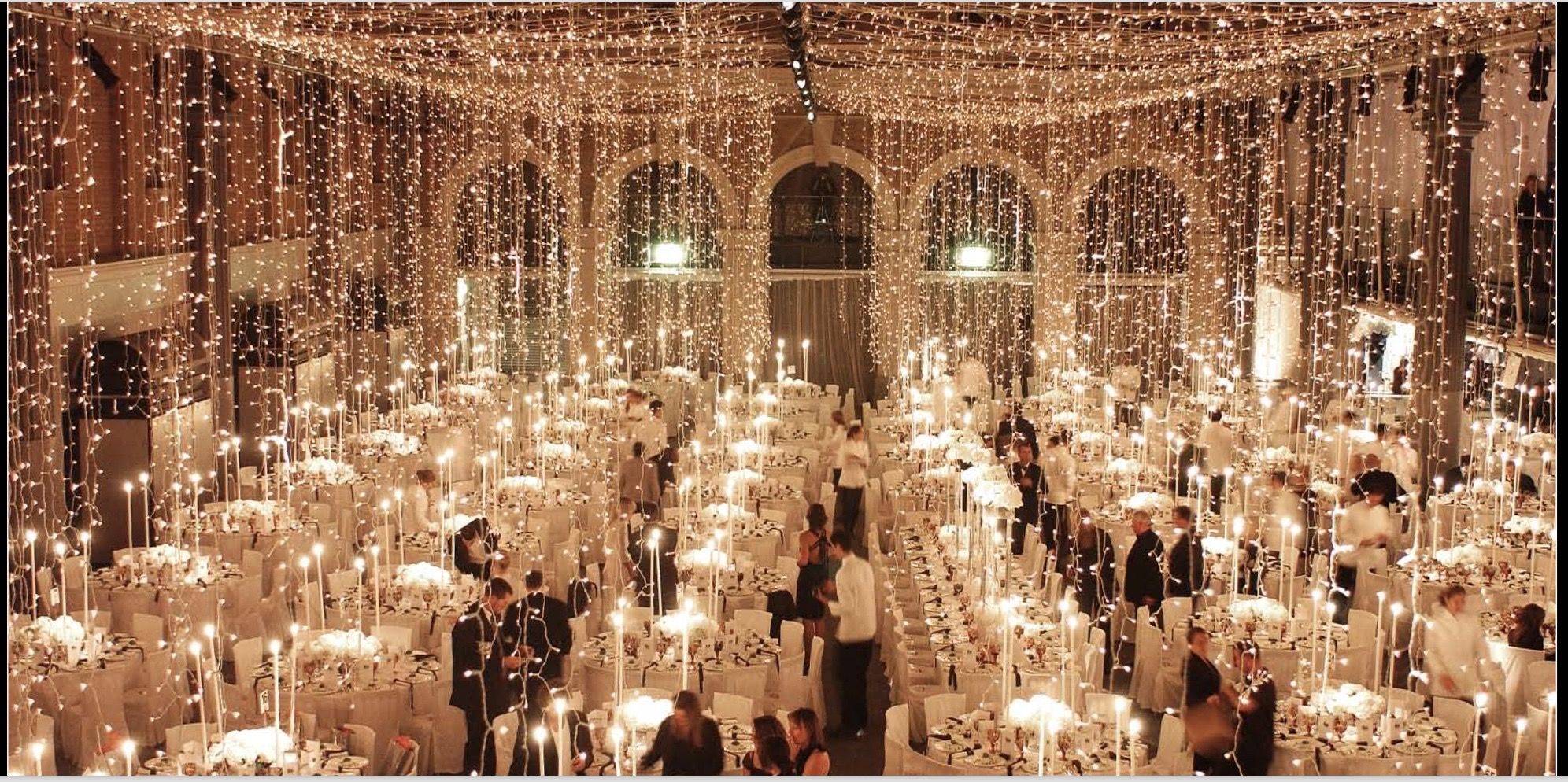 Tables underneath fairy lights falling from the sky