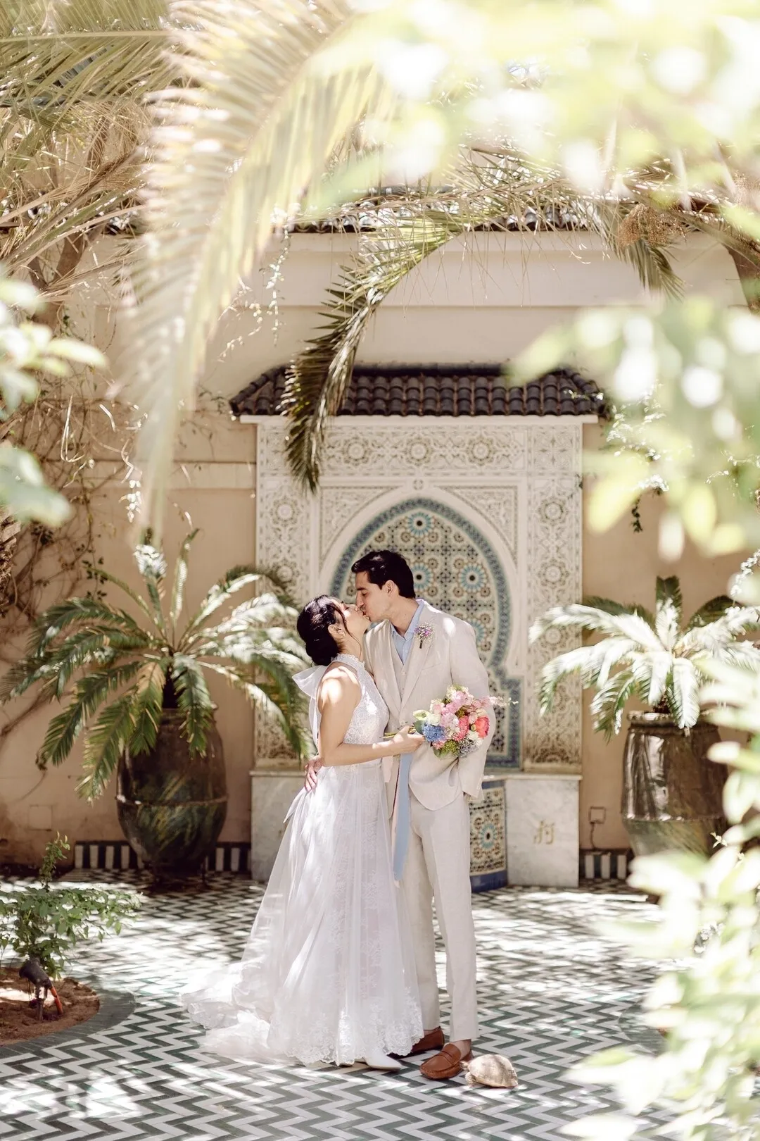 Bride and groom kiss during Marrakech wedding